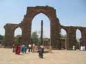 Quwwat-ul-Islam Mosque - Qutbuddin's Screen with Iron pillar in foreground